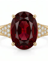 Luxury oval red garnet ring with diamond accents in 18K yellow gold | SARATTI