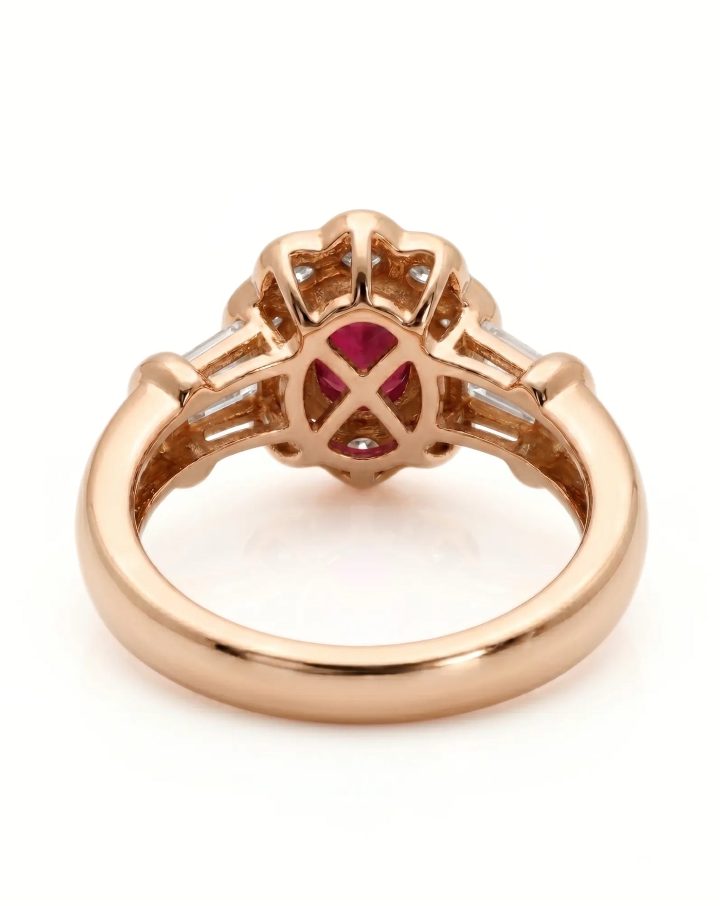 Luxury oval ruby halo ring with diamond accents in refined rose gold | SARATTI