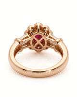Luxury oval ruby halo ring with diamond accents in refined rose gold | SARATTI