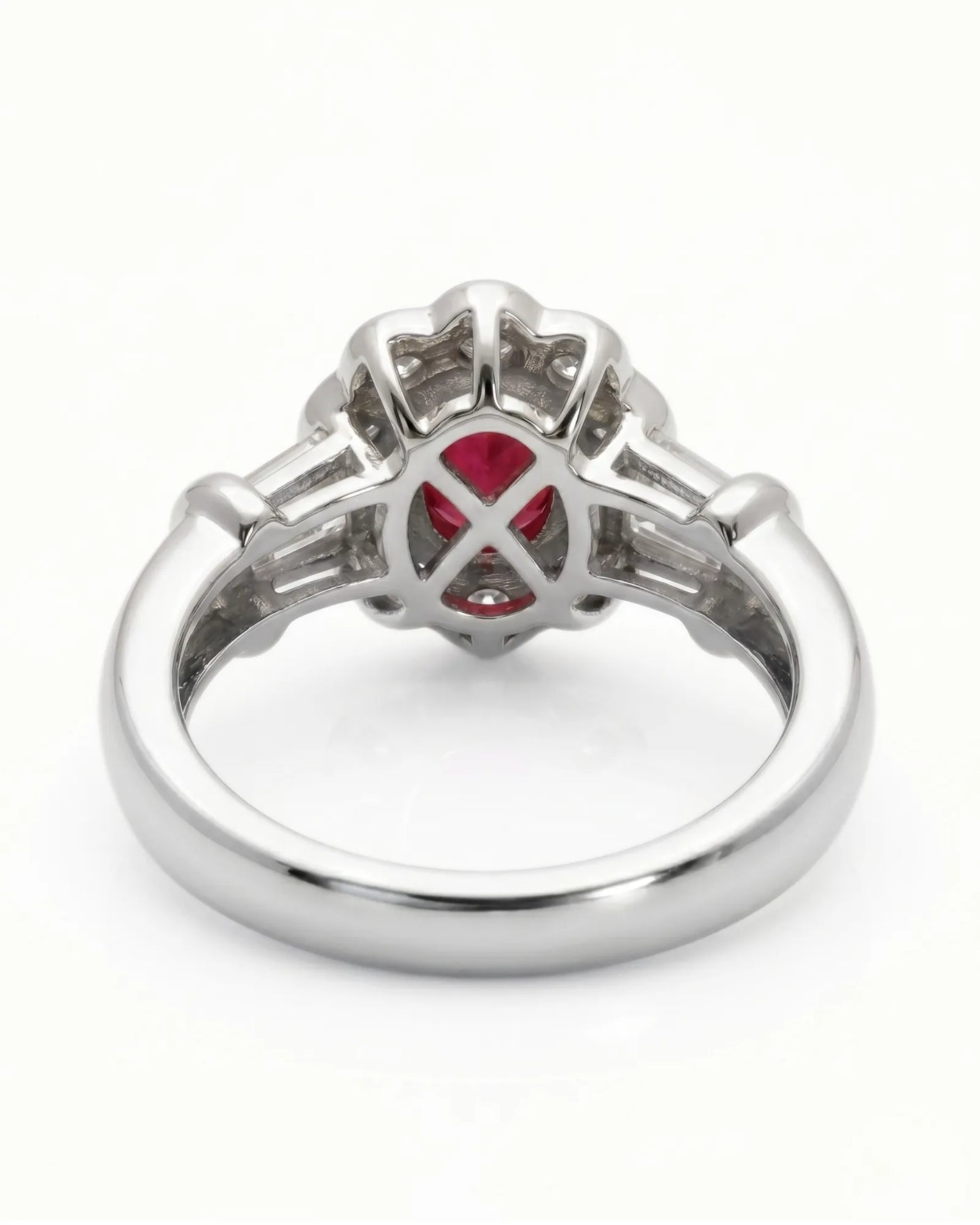 Luxury oval ruby halo ring with diamond accents in refined white gold | SARATTI