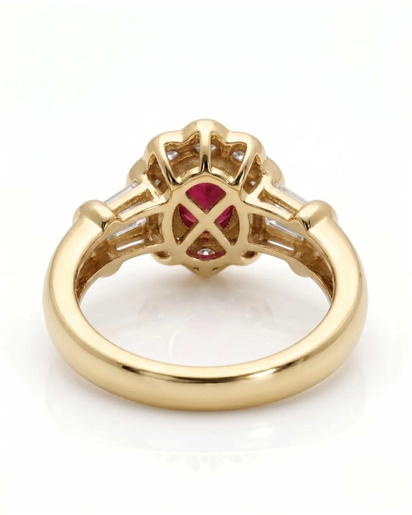 Luxury oval ruby halo ring with diamond accents in refined yellow gold | SARATTI