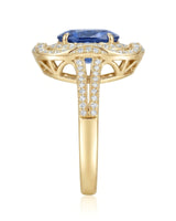 Luxury oval sapphire cocktail ring with diamond halo in 18K yellow gold | SARATTI