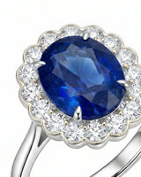 Luxury oval sapphire cocktail ring with diamond halo in platinum | SARATTI