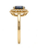 Luxury oval sapphire diamond ring crafted in rich 18K yellow gold | SARATTI