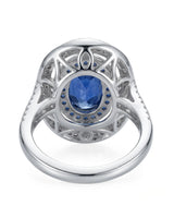 Luxury oval sapphire statement ring with diamond halo in 18K white gold - SARATTI