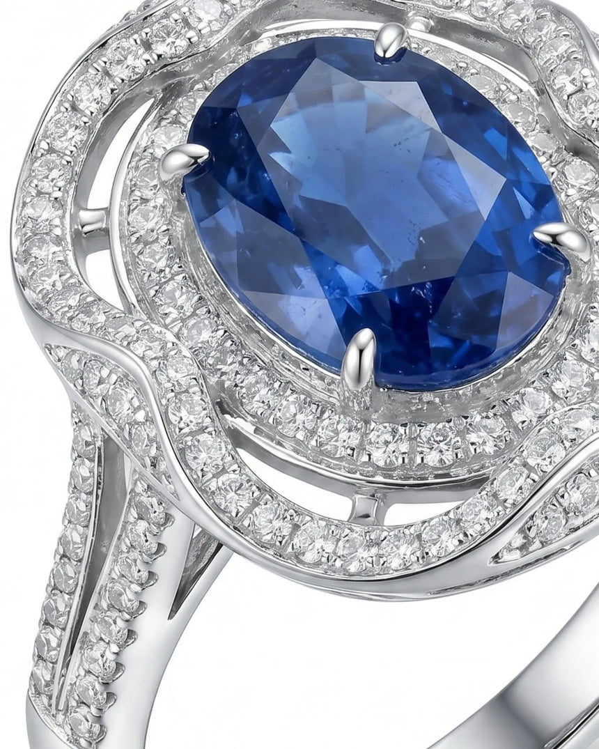 Luxury oval sapphire statement ring with diamond halo in 18K white gold | SARATTI