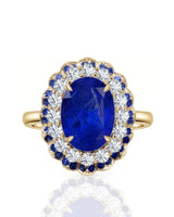 Luxury oval sapphire statement ring with double halo design in 18K yellow gold - SARATTI
