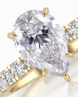 Luxury pear cut moissanite ring with detailed gallery and luminous accents in 18K yellow gold - SARATTI