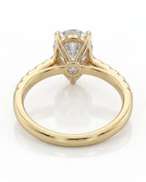 Luxury pear cut moissanite ring with detailed gallery and luminous accents in 18K yellow gold | SARATTI
