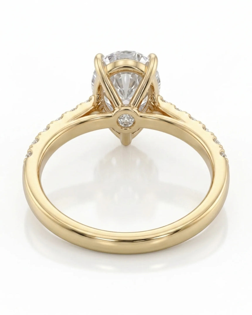 Luxury pear cut moissanite ring with detailed gallery and luminous accents in 18K yellow gold | SARATTI