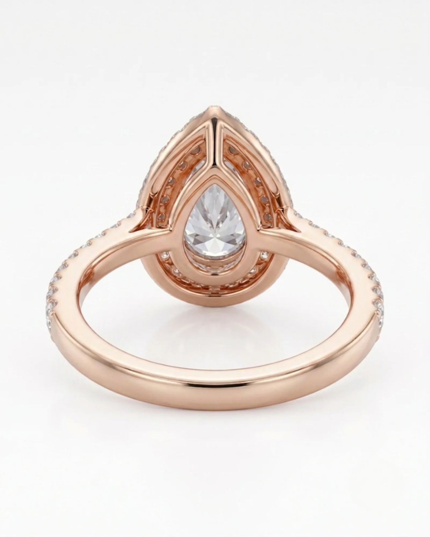 Luxury pear halo moissanite ring combining brilliant accents with warm rose gold elegance - SARATTI