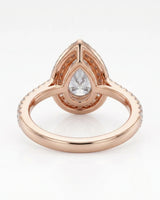 Luxury pear halo moissanite ring combining brilliant accents with warm rose gold elegance - SARATTI