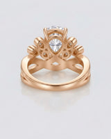 Luxury pear moissanite engagement ring with imperial detailing and refined 18K rose gold craftsmanship - SARATTI