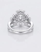 Luxury pear moissanite engagement ring with imperial detailing and refined 18K white gold craftsmanship - SARATTI