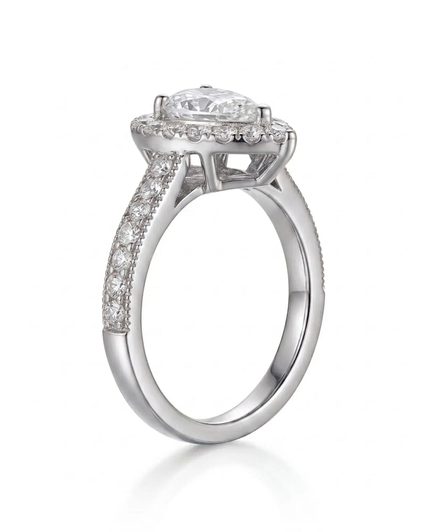 Luxury pear moissanite ring with halo, pavé band, and refined white gold setting | SARATTI