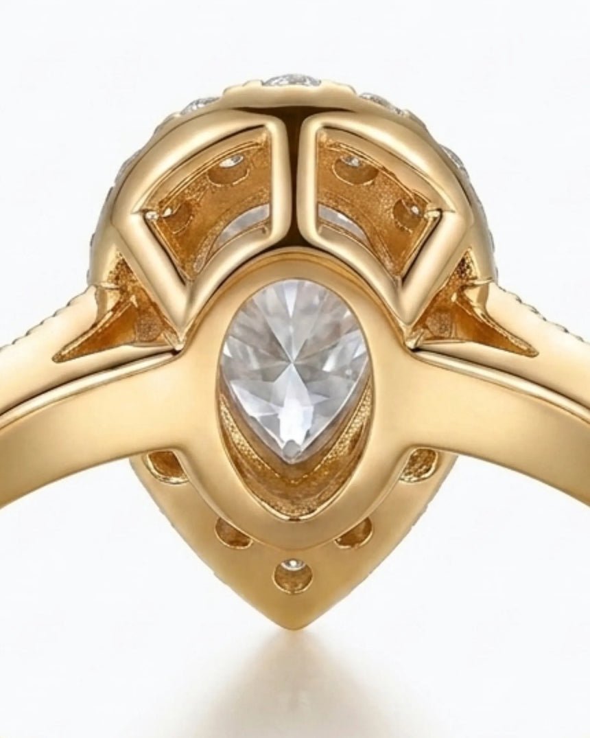 Luxury pear moissanite ring with halo, pavé band, and rich yellow gold setting - SARATTI