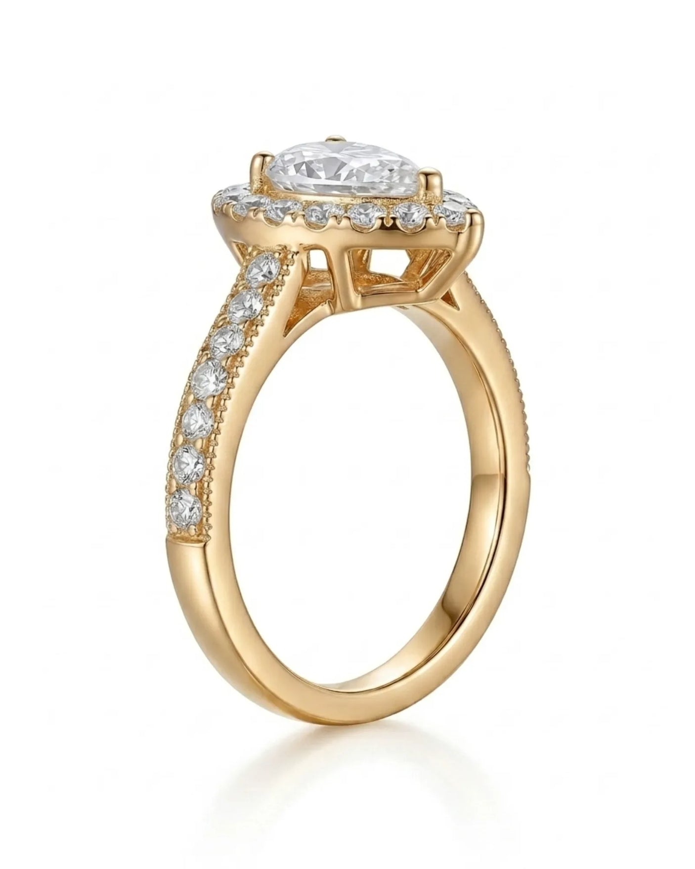Luxury pear moissanite ring with halo, pavé band, and rich yellow gold setting | SARATTI
