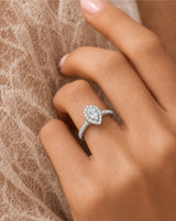 Luxury pear moissanite ring with halo, pavé band, and timeless platinum setting - SARATTI