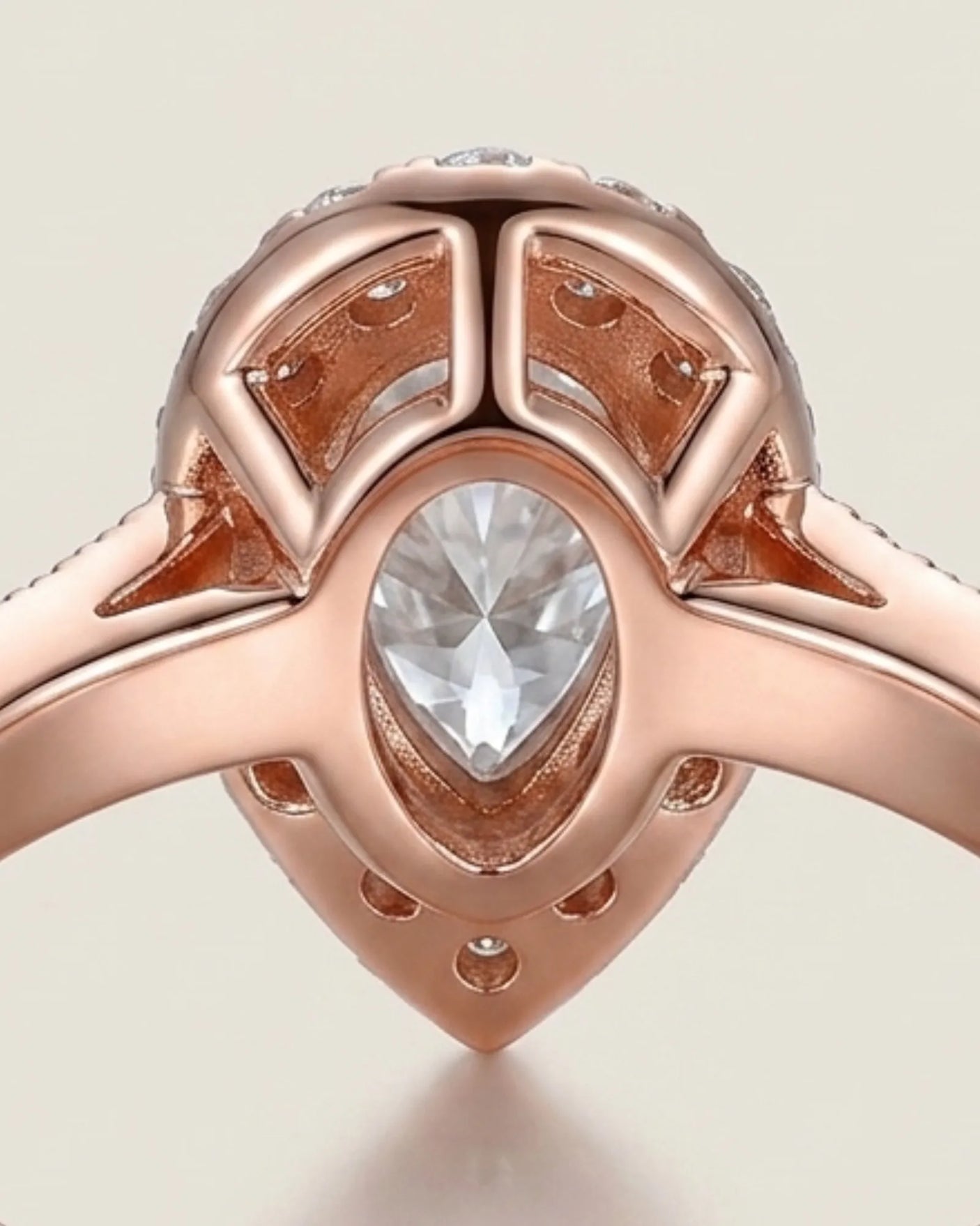 Luxury pear moissanite ring with halo, pavé band, and warm rose gold setting - SARATTI