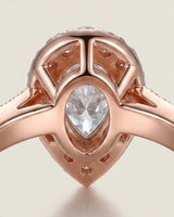 Luxury pear moissanite ring with halo, pavé band, and warm rose gold setting - SARATTI