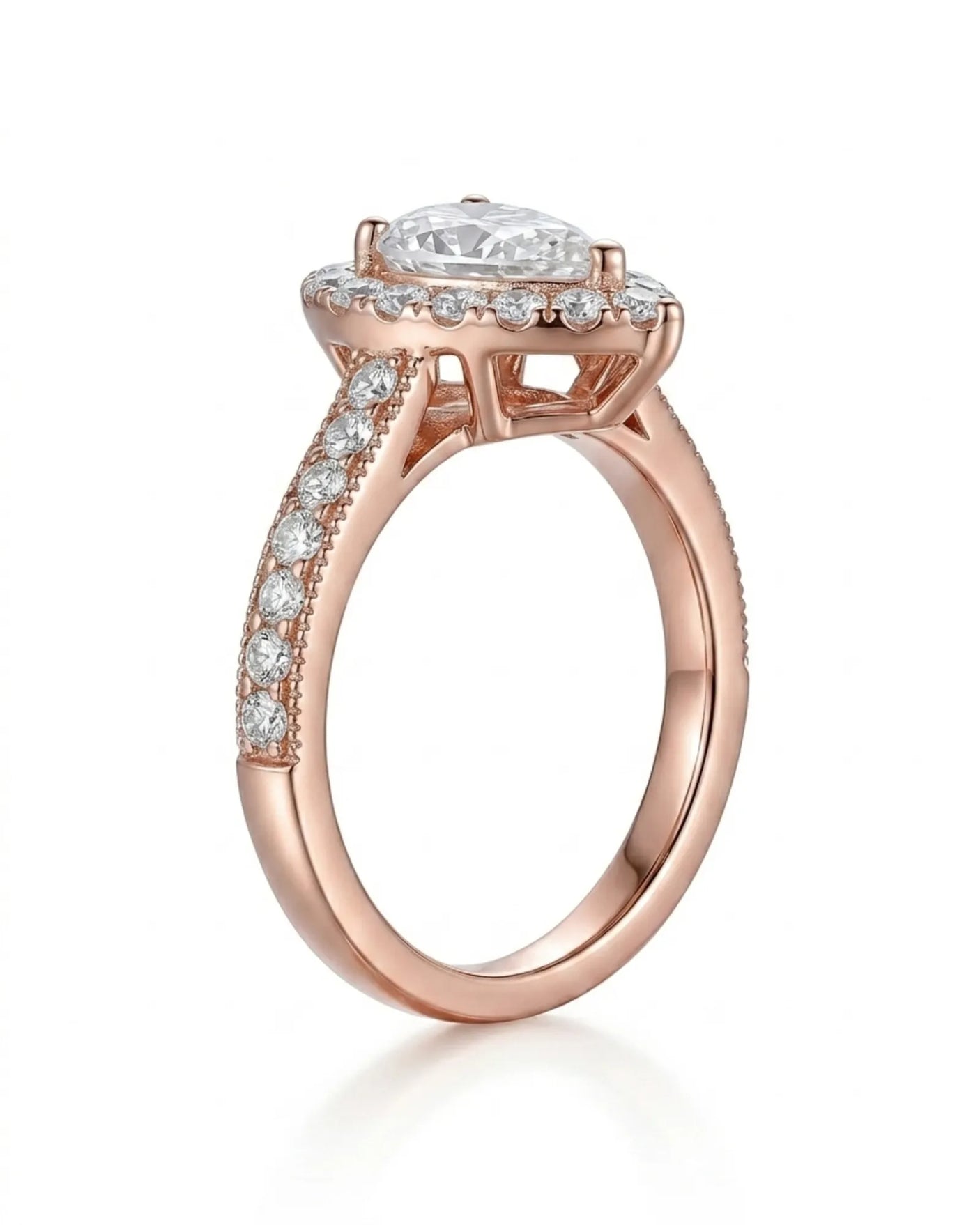 Luxury pear moissanite ring with halo, pavé band, and warm rose gold setting | SARATTI