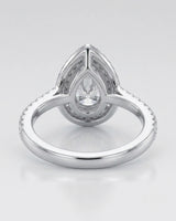 Luxury pear shaped moissanite ring with brilliant halo and pavé shoulders in 18K white gold - SARATTI