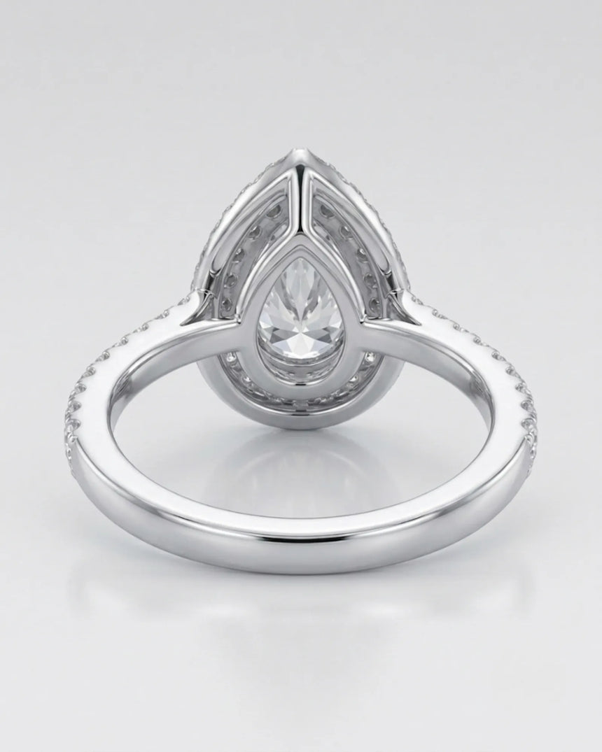Luxury pear shaped moissanite ring with brilliant halo and pavé shoulders in 18K white gold - SARATTI