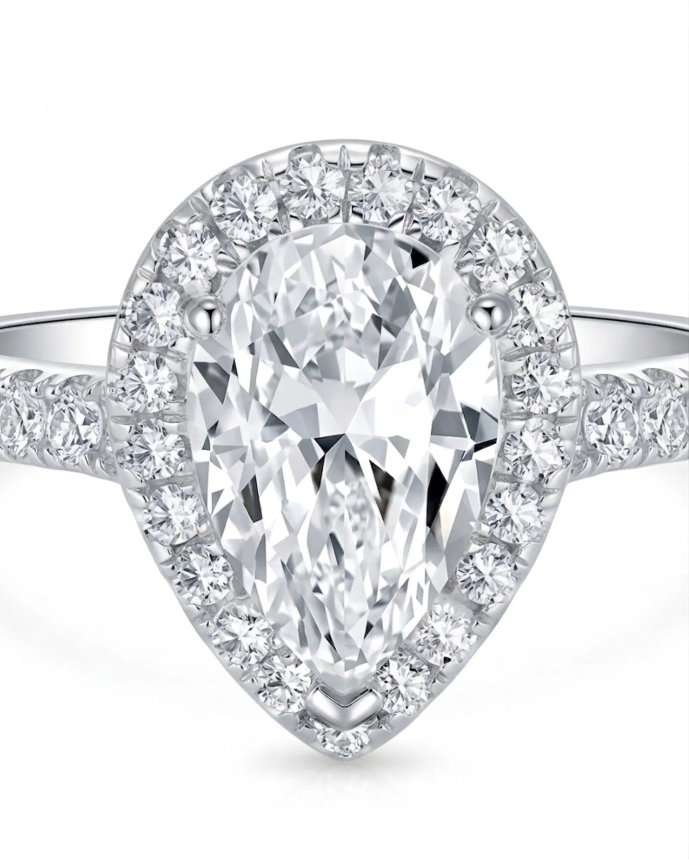 Luxury pear shaped moissanite ring with brilliant halo and pavé shoulders in 18K white gold | SARATTI