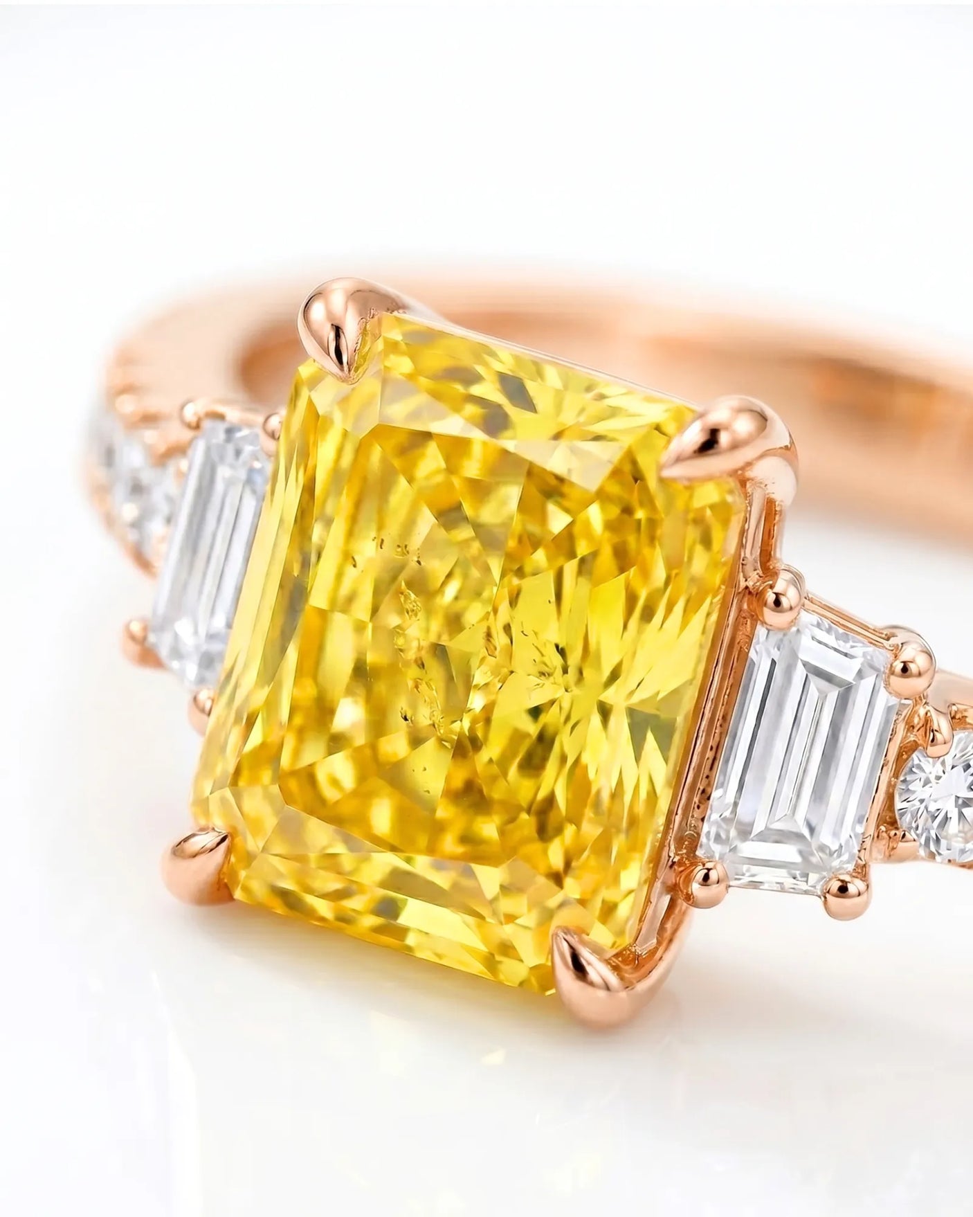 Luxury radiant sapphire ring with trapezoid diamonds in polished 18K rose gold | SARATTI