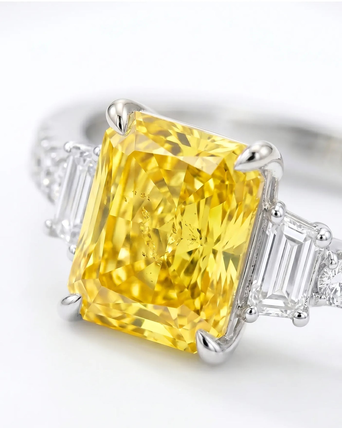 Luxury radiant sapphire ring with trapezoid diamonds in polished 18K white gold |-SARATTI