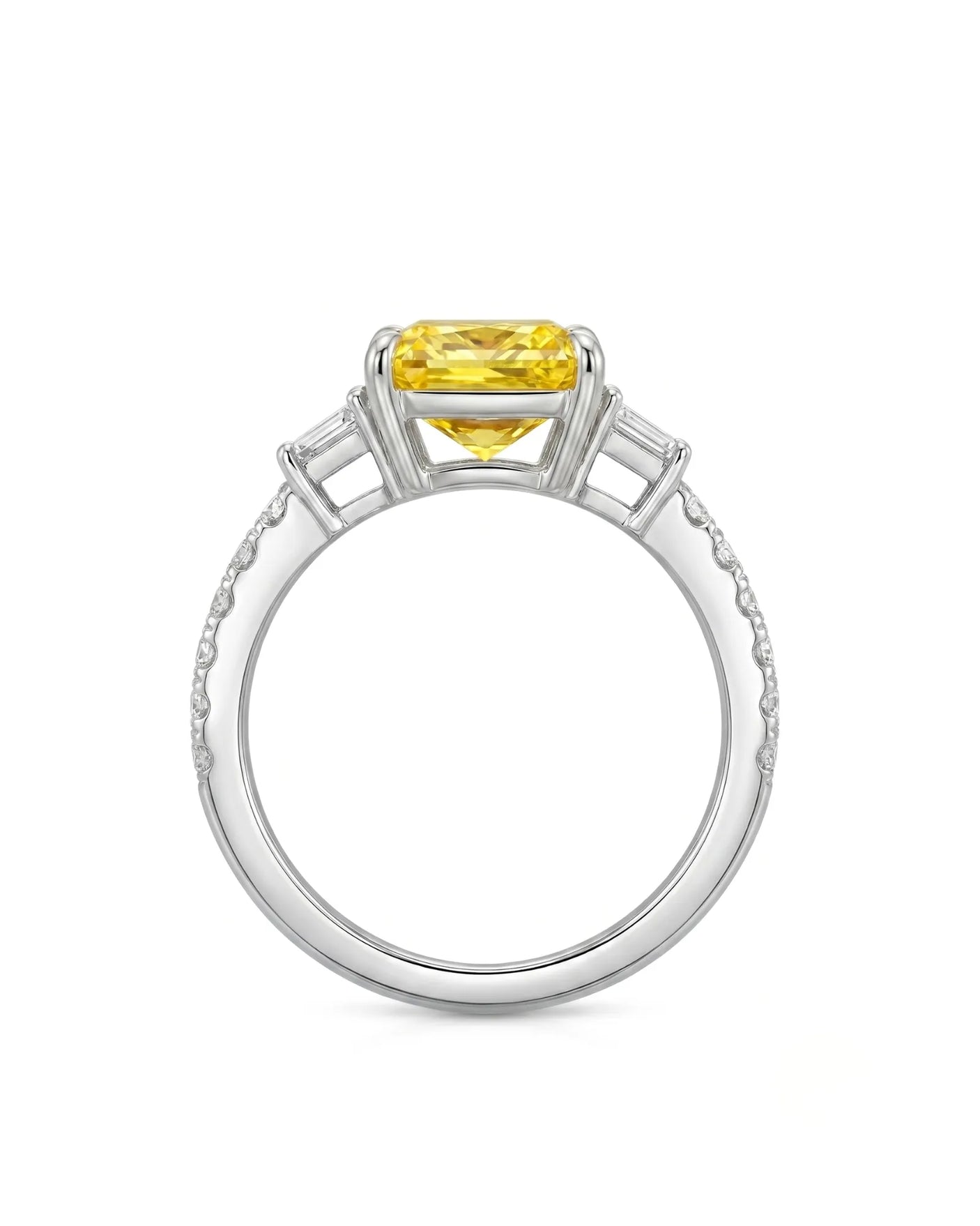 Luxury radiant sapphire ring with trapezoid diamonds in polished 18K white gold | SARATTI