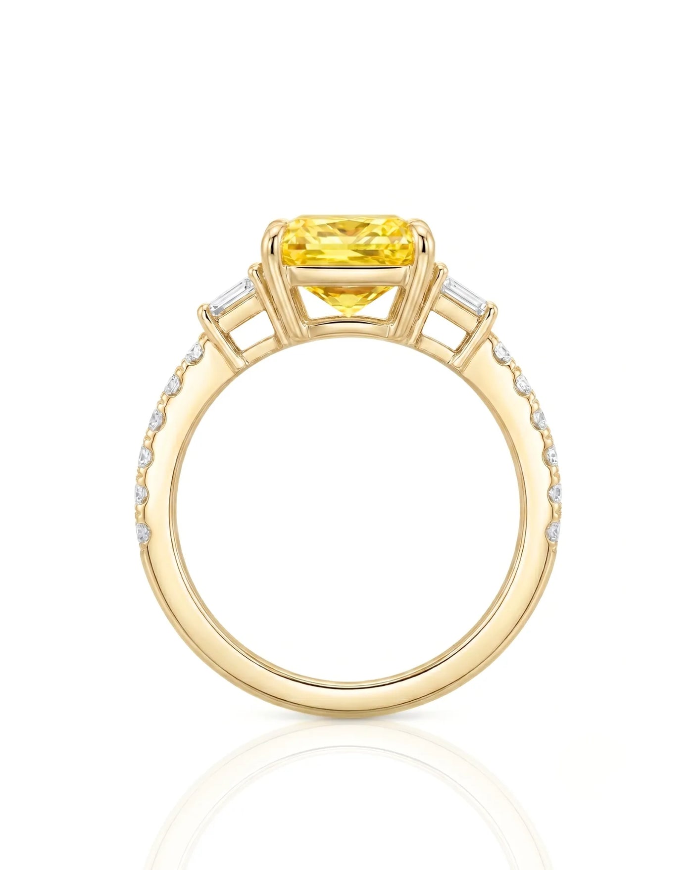 Luxury radiant sapphire ring with trapezoid diamonds in polished 18K yellow gold | SARATTI