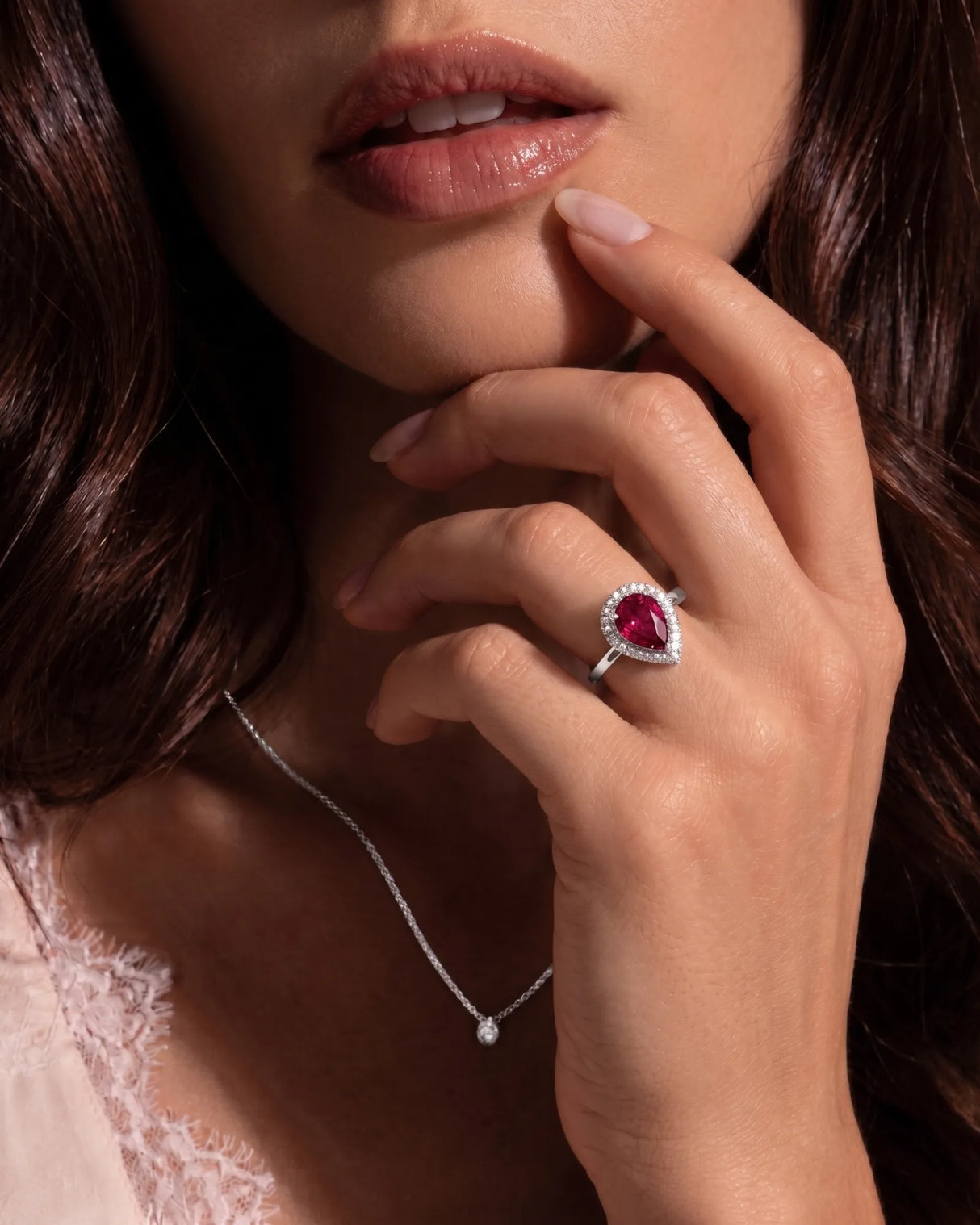 Luxury red-pink tourmaline ring with pear shape and diamonds in platinum | SARATTI