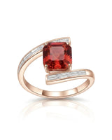 Luxury reddish pink tourmaline and diamond ring in rose gold with modern bypass design | SARATTI