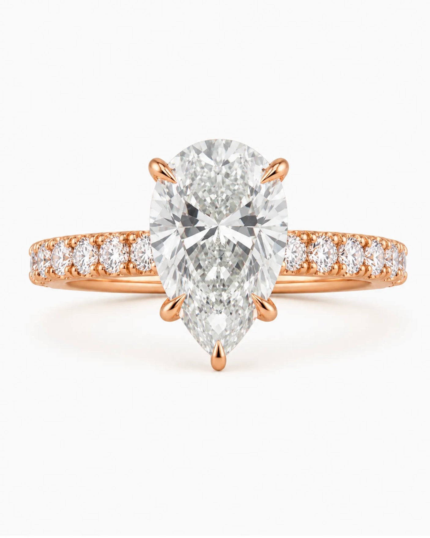 Luxury rose gold pear cut moissanite ring with luminous side stones and elegant balance | SARATTI