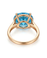 Luxury round blue topaz cocktail ring with diamond-accented shoulders in polished 18K rose gold - SARATTI