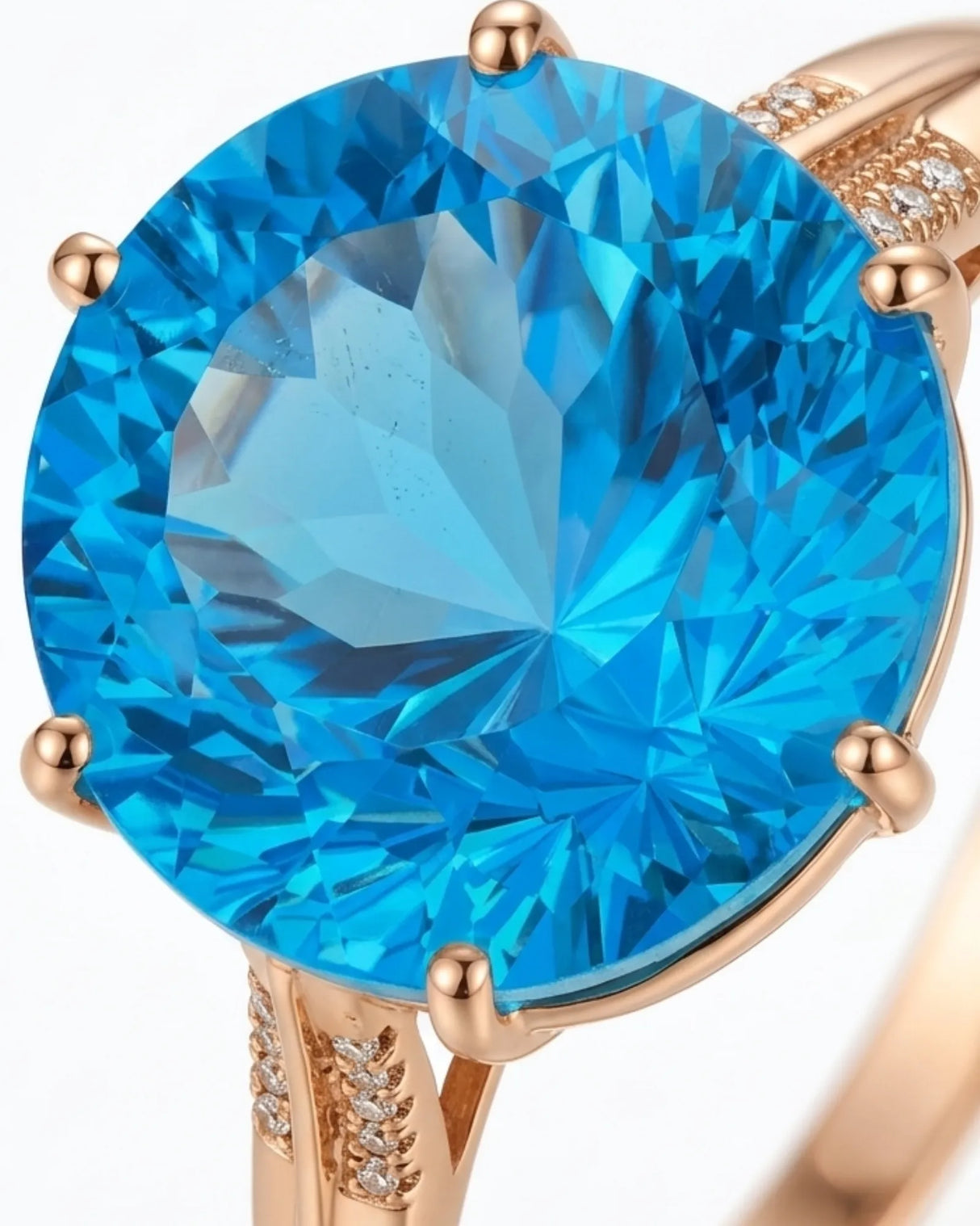 Luxury round blue topaz cocktail ring with diamond-accented shoulders in polished 18K rose gold | SARATTI