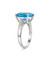 Luxury round blue topaz cocktail ring with diamond-accented shoulders in polished 18K white gold | SARATTI