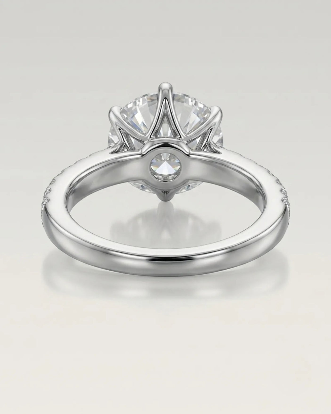 Luxury round diamond proposal ring with elevated prong setting and pavé 18K white gold band - SARATTI