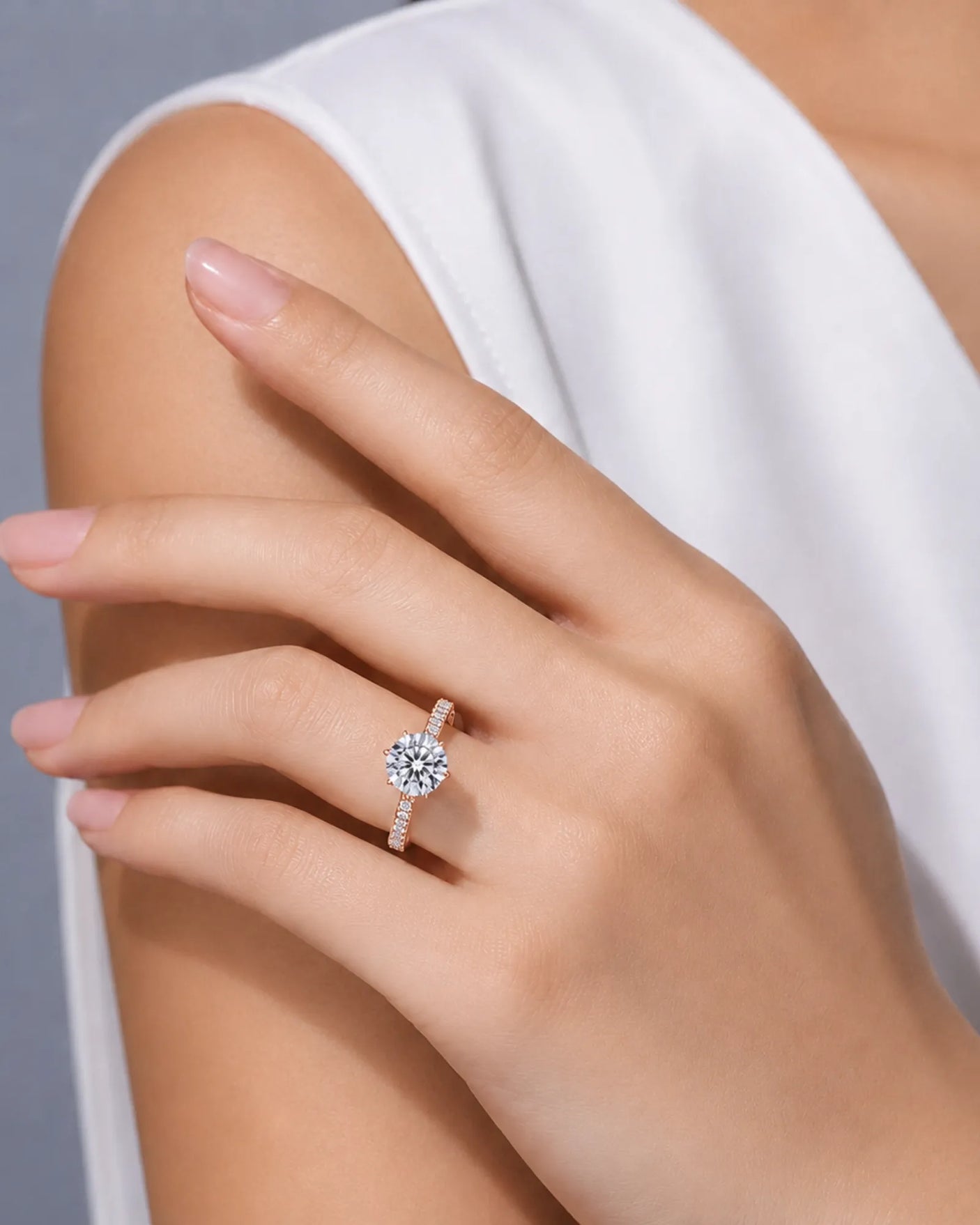 Luxury round diamond proposal ring with elevated setting and refined 18K rose gold detailing |- SARATTI