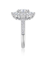 Luxury round moissanite ring with flower-inspired cluster and refined 18K white gold craftsmanship | SARATTI