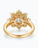 Luxury round moissanite ring with flower-inspired cluster and rich 18K yellow gold craftsmanship - SARATTI