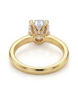 Luxury round moissanite ring with hidden pavé detail and rich yellow gold setting - SARATTI
