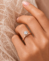 Luxury round moissanite ring with hidden pavé detail and soft rose gold setting | SARATTI