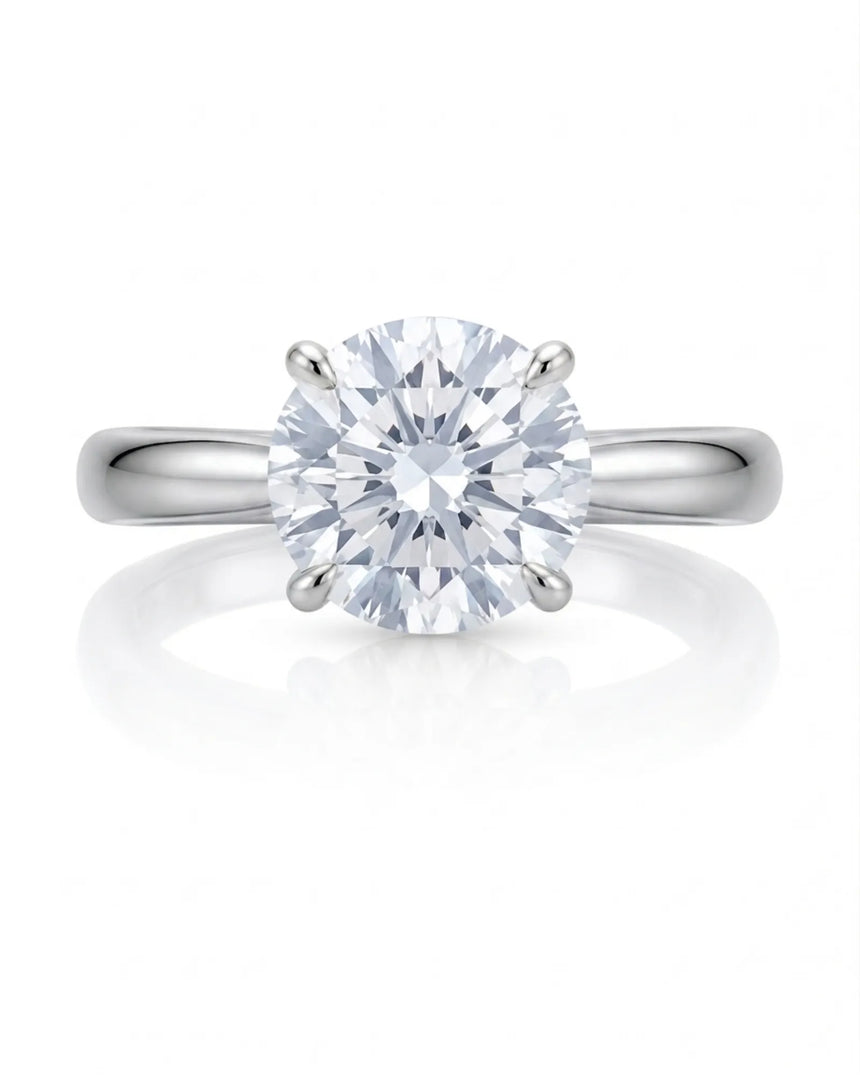 Luxury round moissanite ring with hidden pavé detail and timeless 18K white gold setting | SARATTI