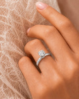 Luxury round moissanite ring with hidden pavé detail and timeless platinum setting - SARATTI