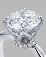 Luxury round moissanite ring with hidden pavé detail and timeless platinum setting | SARATTI