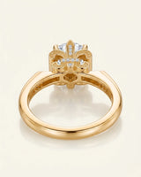 Luxury round moissanite ring with pavé accents and ornamental fleur-de-lis gallery crafted in 18K yellow gold - SARATTI