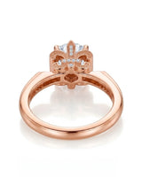 Luxury round moissanite ring with pavé accents and sculptural fleur-de-lis gallery crafted in 18K rose gold | SARATTI