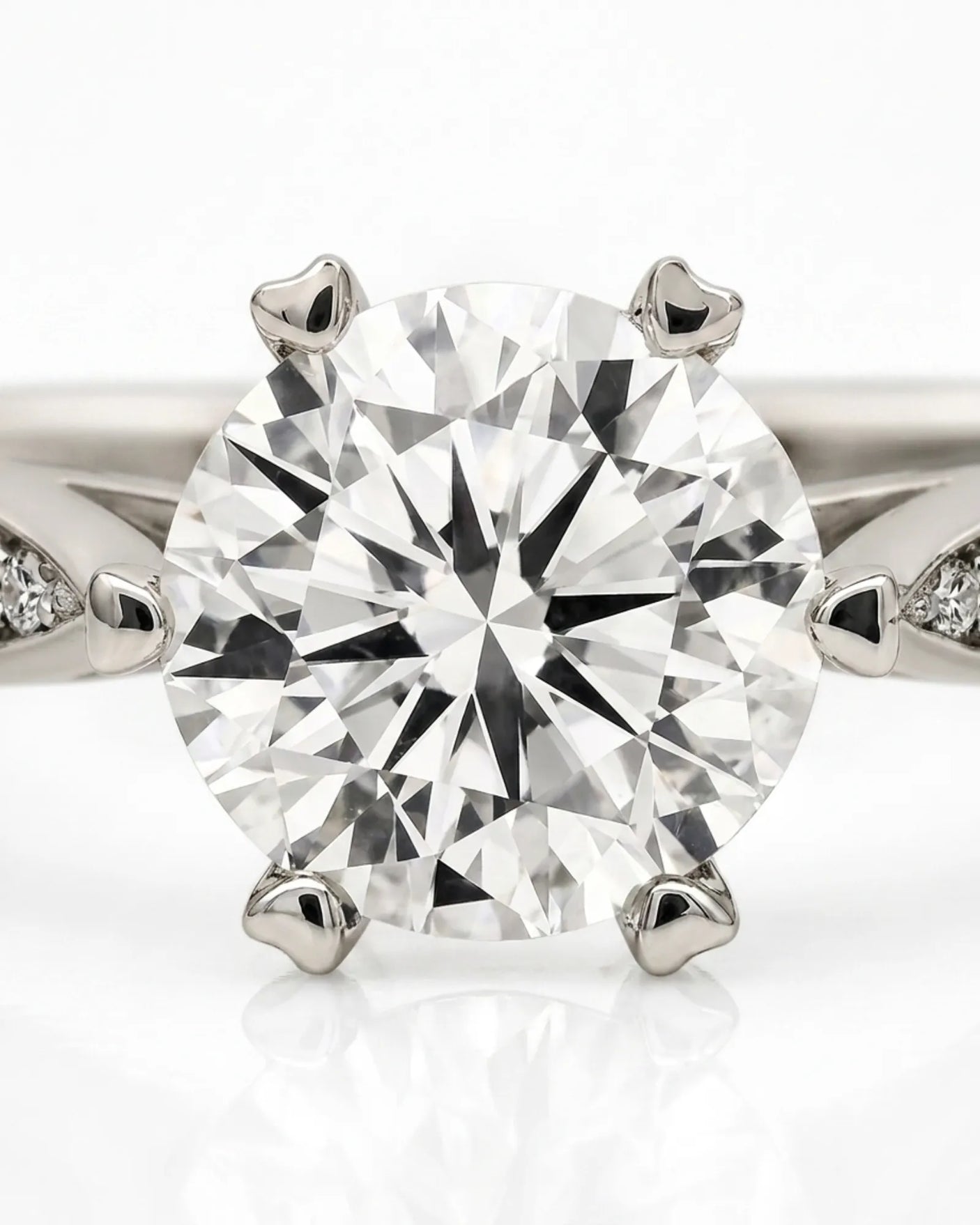 Luxury round moissanite ring with pavé shoulders and elevated six-prong profile | SARATTI